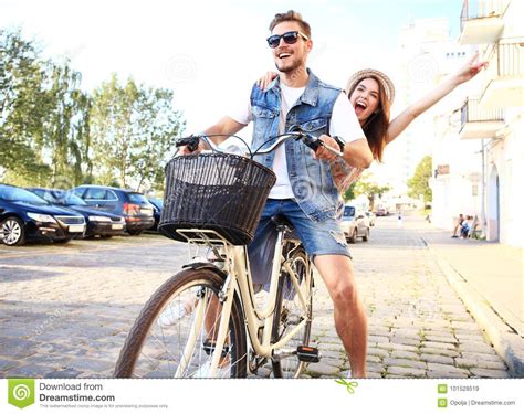 Happy Funny Young Couple Riding On Bicycle Stock Image Image Of Park