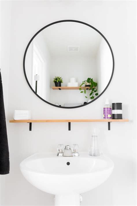 Tiny Monochrome Powder Room With Plants Open Shelving For Storage A