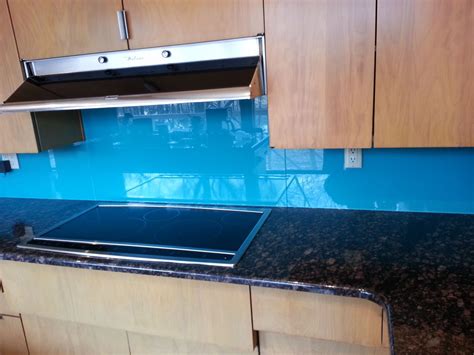 The glass was just mounted over the chosen backsplash wall paint color which is fine if your wall was perfectly smooth and well finished but it does make for a better finish to actually paint the glass and let it completely dry first… it scrapes off after soaking w a hotwater sponge easily if you do want to change the colour…the glass also. 7 Cool Uses of Glass in a Contemporary Luxury Home