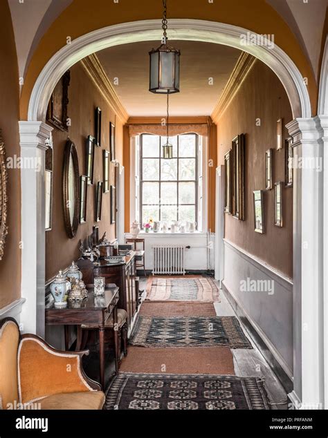 Arched Georgian Hallway Withframed Artworks And Ceramics Stock Photo