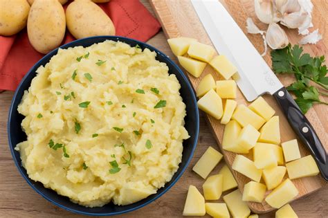 Put potatoes in the pan and boil them without removing the skins until they are cooked, make sure they aren't too soft. Garlic Mashed Potatoes