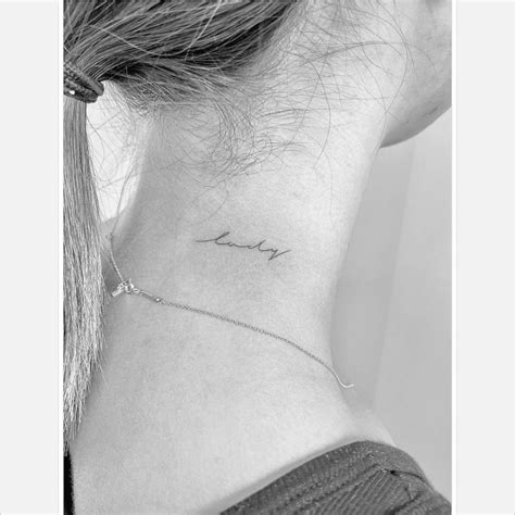 Lady Lettering Tattoo On The Neck