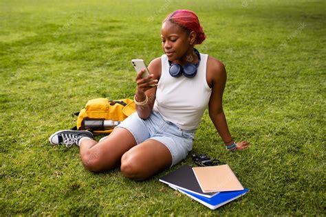 Premium Photo Portrait Of Braless Woman Outdoors With Smartphone