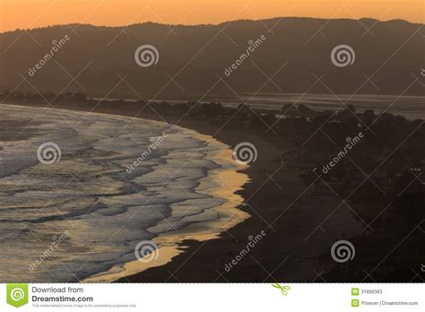 Golden Sunset Reflects On Water S Edge At Stinson Beach Stock Image