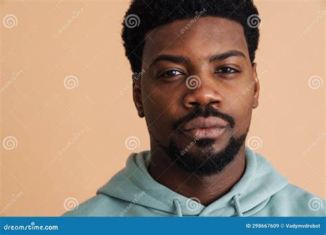 Black Young Man Wearing Hoodie Posing And Looking At Camera Stock Image