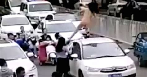 Naked Woman Dances On Top Of Car Causing Traffic Jam Before Driver