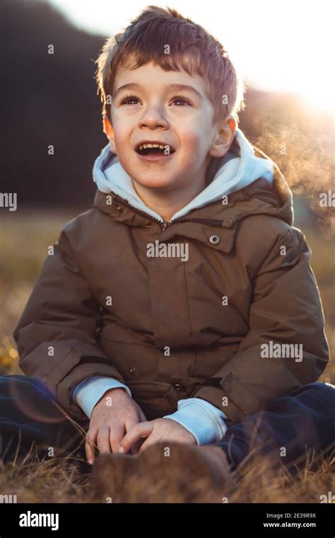 Portrait Of A Cute Little Boy Looking At Something In Awe With An
