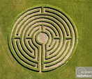 Labyrinth in meadow, hedge maze, | Stock Photo