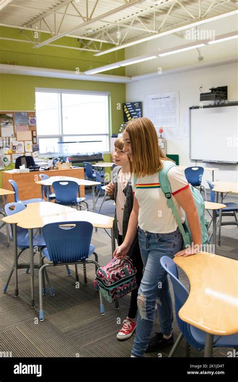 Junior High Girl Students Leaving Classroom Together Stock Photo Alamy