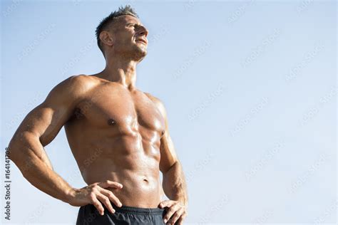 Handsome Middle Aged Man Working Out On A Running Track Healthy Adult Man Sun Baiting Tanned