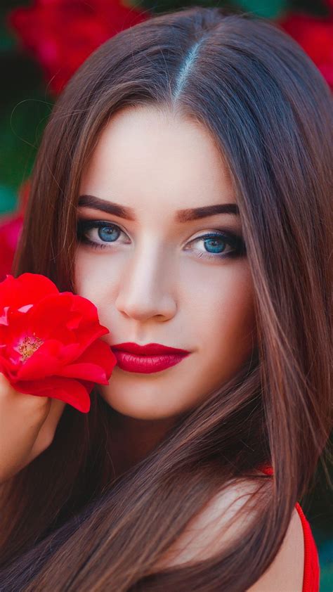 blue eyes woman with flower red outdoor photoshoot 1080x1920 wallpaper most beautiful faces
