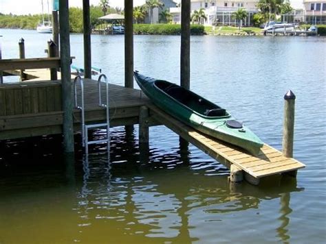 From commercial to residential projects, floating piers using wood or aluminum, rowing or kayak docks, swim platforms. Great idea when building dock/deck to have a launch for kayaks as well | Lake dock, Lake cottage ...