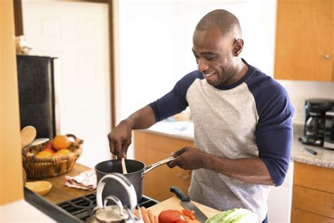 Man Standing Happiness On The Kitchen And Preparing Food — Foundation