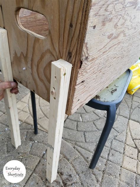 Attach these vertically inside the box in the middle. DIY Raised Flower Box with Legs - Everyday Shortcuts