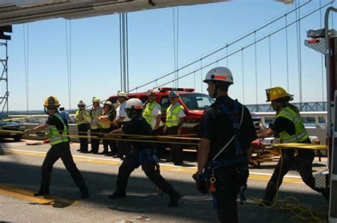 Emergency Crews Rescue Injured Worker From Beneath Bridge