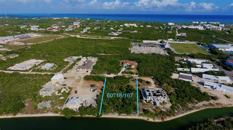 What does an acre equal? 0.58 Acre Canal Front lot - National Colony Realty