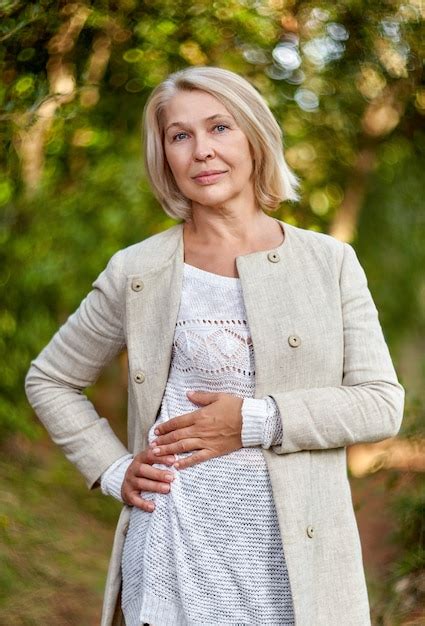 Premium Photo Portrait Of Elegant Mature Woman In The Forest