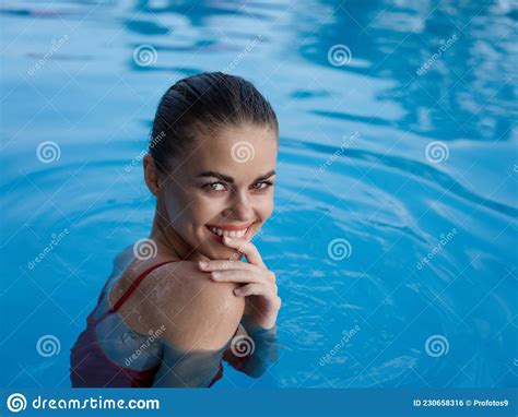 Cheerful Woman Swimming In The Pool Rest Clear Water Stock Photo