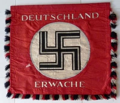 What does erwache mean in german? NSDAP Standarte "Deutschland Erwache"