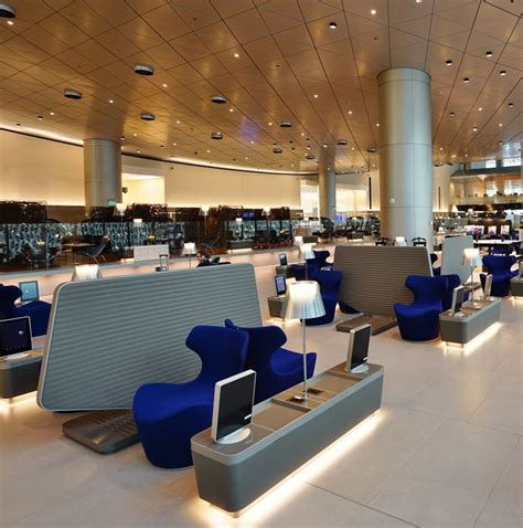 Doha Qatar Business Class Airport Lounge With Luxruious Blue Recliners