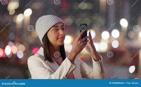 Tourist Taking A Selfie On A Phone In A City Alone At Night Young