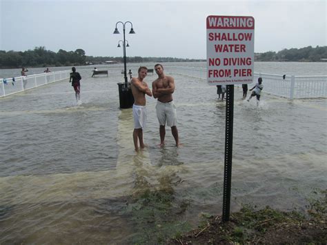 Warning Shallow Water No Diving From Pier During Hurricane Isaac
