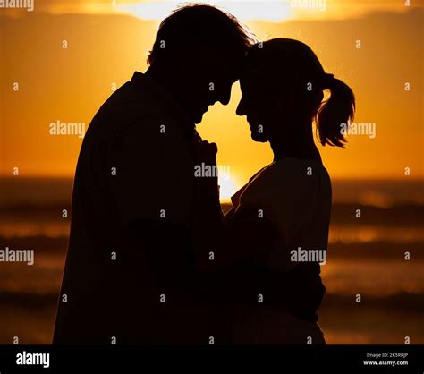 Silhouette Affectionate Senior Couple Sharing An Intimate Moment On The