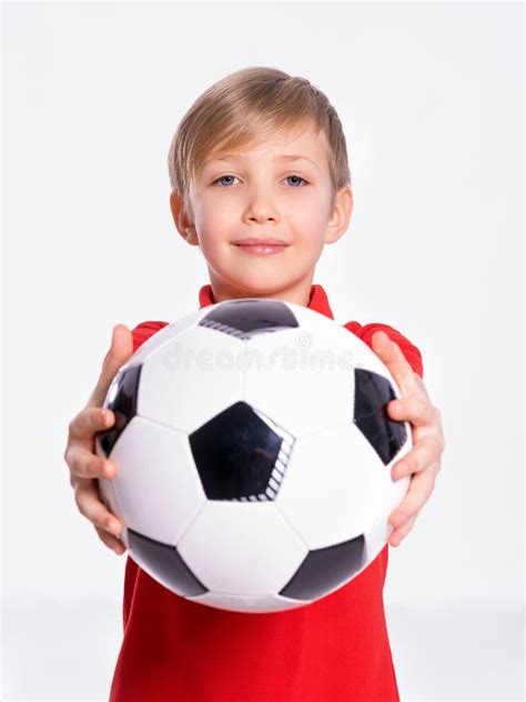 White Child Holds A Soccer Ball Pretty 8 Years Old Kid In A Red T