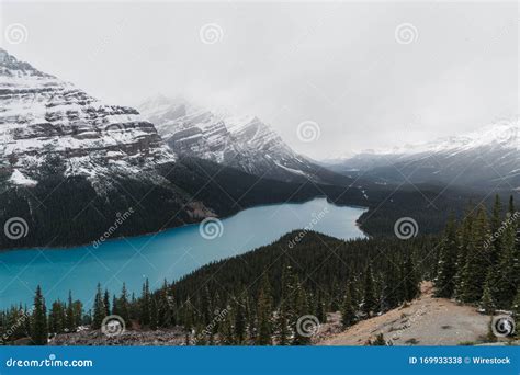 High Angle Shot Of A Clear Frozen Lake Surrounded By A Mountainous