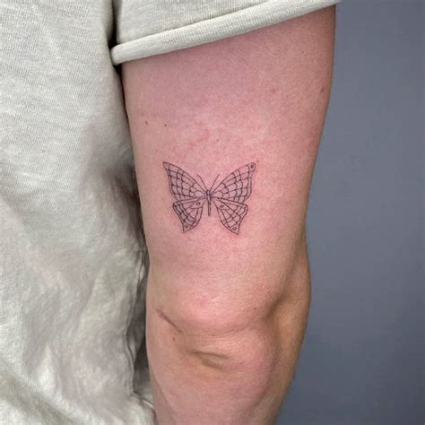 Fine Line Butterfly Tattoo On The Tricep