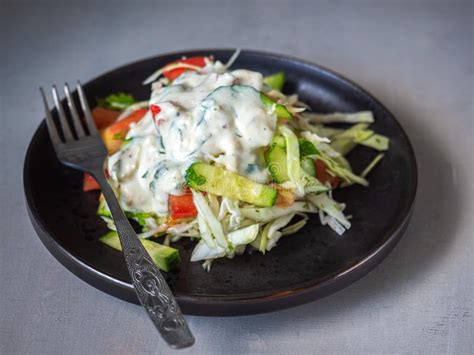 Simple Light Breakfast Coleslaw With Vegetables On A Dark Plate On A