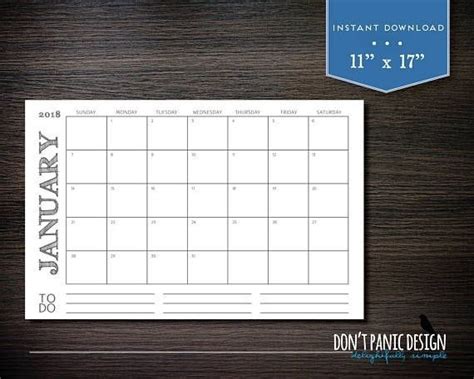 The Printable Calendar Is Displayed On Top Of A Wooden Table With A