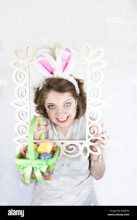 Beautiful Young Woman Wearing Rabbit Ears And Holding Easter Basket