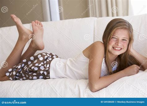 Young Girl Relaxing On Sofa At Home Stock Photo Image Of Caucasian