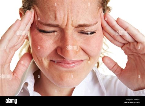 Business Woman With Headache Massaging Her Aching Temples Stock Photo