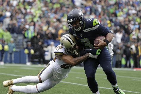 Nfl quarterback seattle seahawks ceo of west2east empire. Seattle Seahawks' Russell Wilson setting QB standard for ...