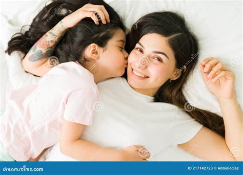 Loving Girl Kissing Her Mom On The Cheek Stock Image Image Of
