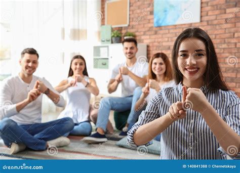 Young Teacher Showing Sign Language Gesture Stock Photo Image Of