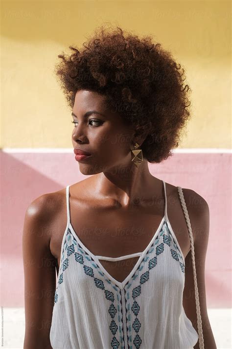Portrait Of Beautiful Black Woman With Afro Hairstyle Wearing White
