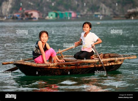 Girls In A Rowing Boat At Halong Bay Gulf Of Tonkin Vietnam Stock