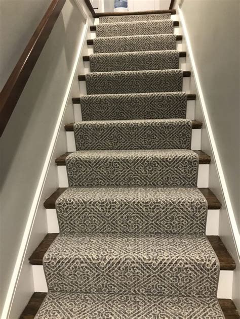 A Carpeted Staircase Leading Up To An Open Door