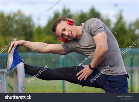 Muscular Athlete Stretches Hamstring Stadium Field Stock Photo