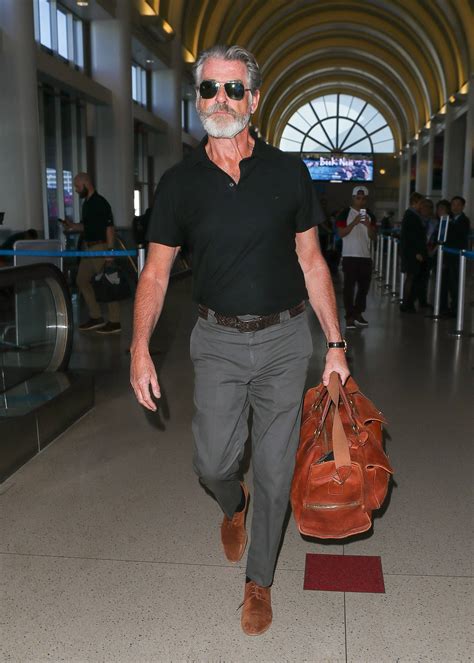 pierce brosnan nails airport style time and time again most stylish men polo outfit mens