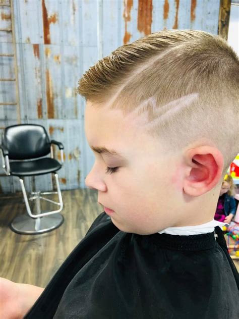 This is one of the best haircut designs we've ever seen. Lightning Bolt Mohawk Haircut - Haircuts Models Ideas