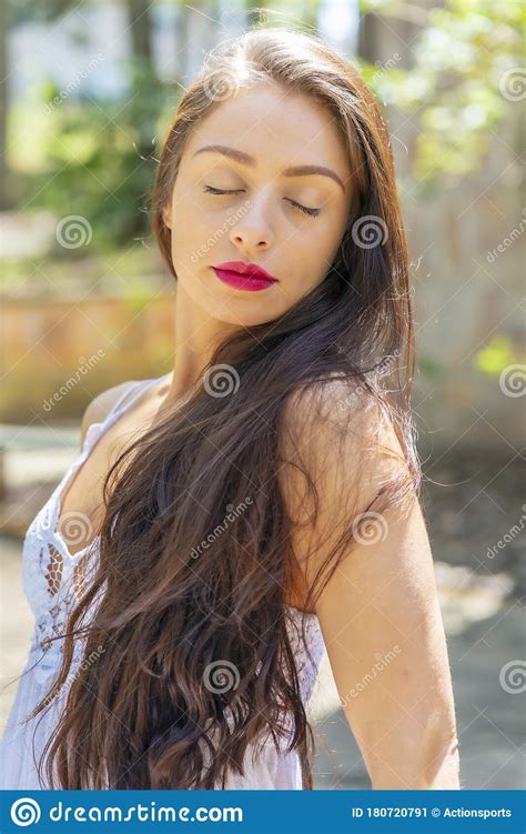 A Lovely Brunette Model Enjoys An Spring Day Outdoors Stock Image Image Of Eyes Happy 180720791