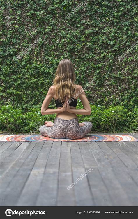 Rear View Woman Practicing Yoga Lotus Pose Making Namaste Gesture Stock Photo