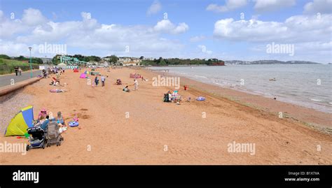 Panoramic Image Of Holidaymakers Enjoying The Sandy Beach At Goodrington South Near Paignton In