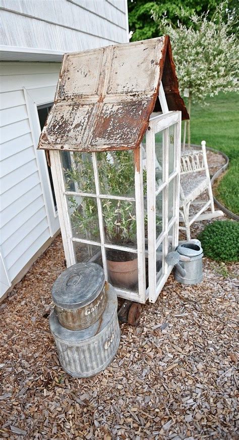 We had the sink moved in front where the window is located. DIY Window Greenhouse | Rustic greenhouses, Diy garden ...