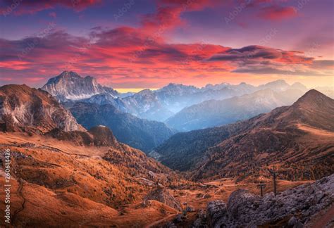 Colorful Red Sky With Clouds Over The Beautiful Mountains In Fog At