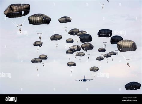 Us Army Paratroopers With The 82nd Airborne Division Parachute From An